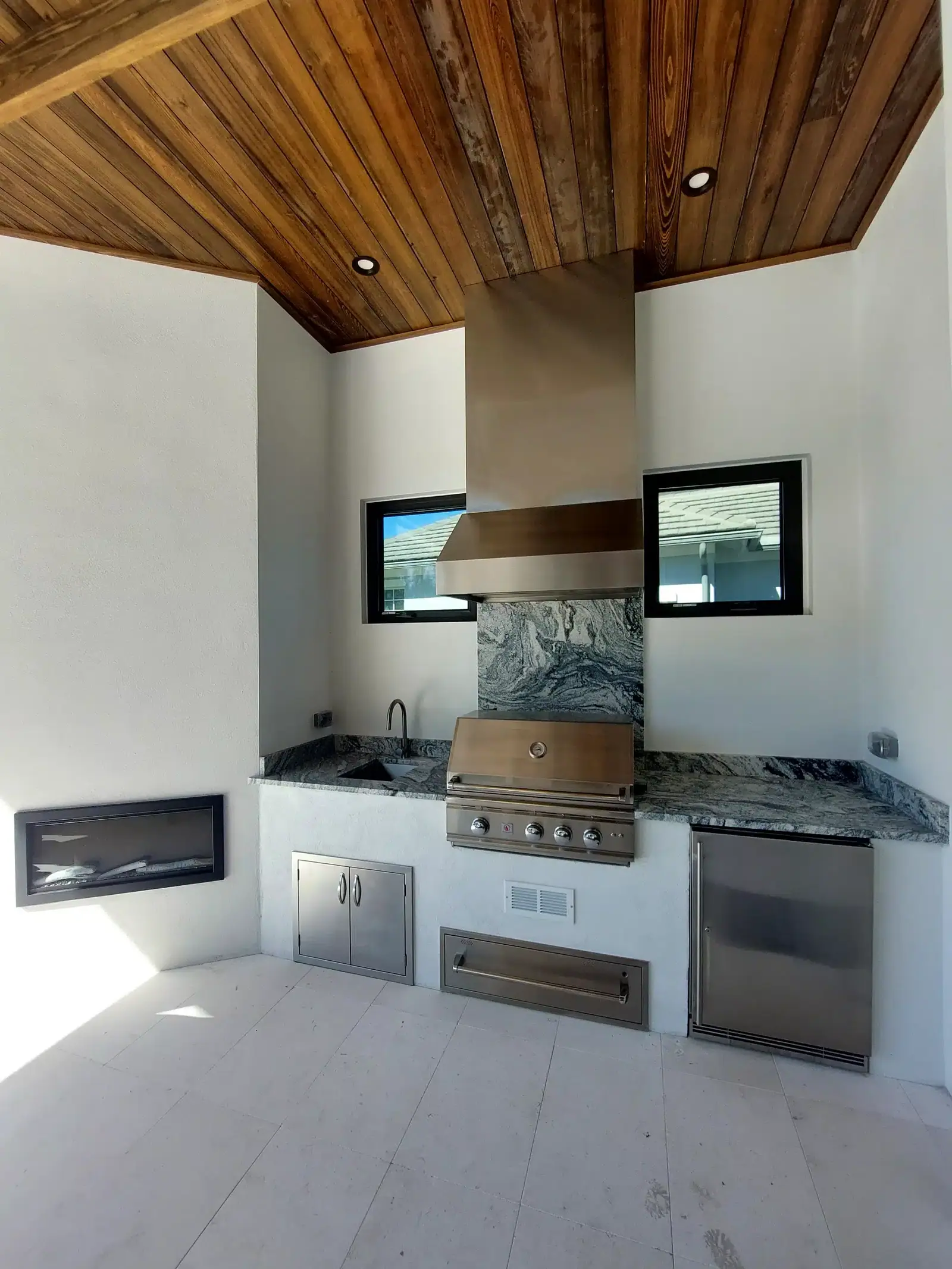 Outdoor kitchen range hood installation
