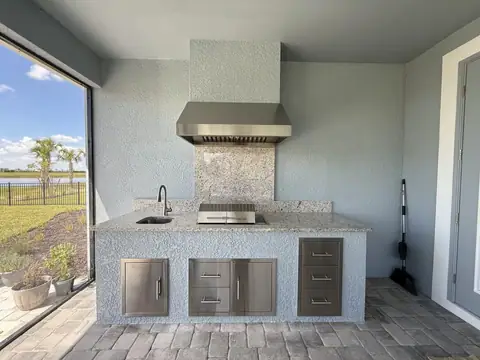A simple stucco outdoor kitchen installed in Bonita Springs, FL with house match paint. A simple stucco outdoor kitchen installed in Bonita Springs, FL with house match paint.