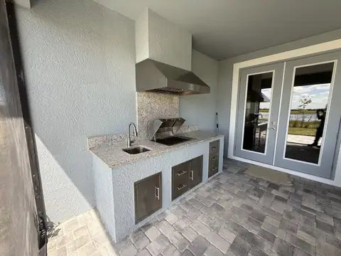 An outdoor kitchen with electric Kenyon Grill installed in Bonita Springs, FL. An outdoor kitchen with electric Kenyon Grill installed in Bonita Springs, FL.
