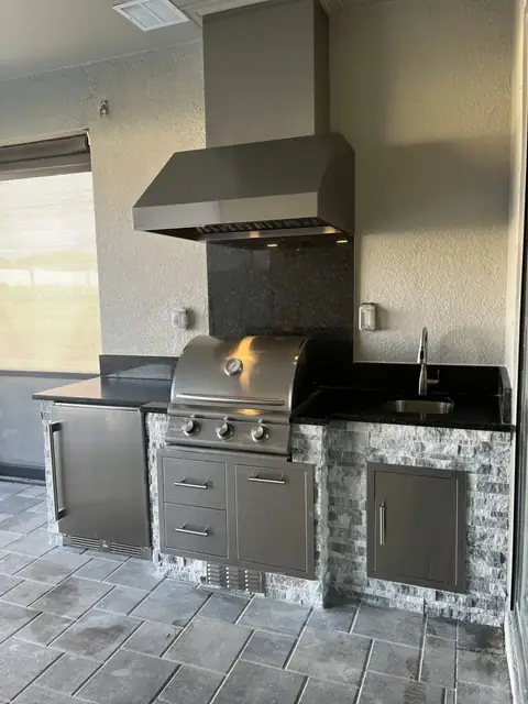 An outdoor kitchen with grill bump out done in Ft Myers, FL. An outdoor kitchen with grill bump out done in Ft Myers, FL.