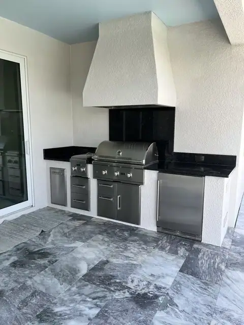 An outdoor kitchen with custom hood surround built in Ft Myers, FL. An outdoor kitchen with custom hood surround built in Ft Myers, FL.