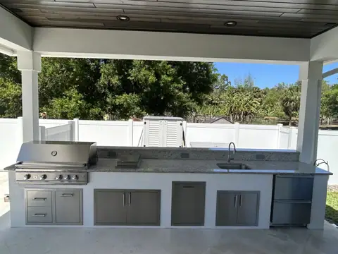 A custom outdoor standalone kitchen with storage constructed in Esplanade Lakes, FL. A custom outdoor standalone kitchen with storage constructed in Esplanade Lakes, FL.