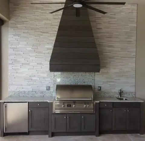 A Naturekast outdoor kitchen with custom naturkast hood surround built in Naples, FL. A Naturekast outdoor kitchen with custom naturkast hood surround built in Naples, FL.